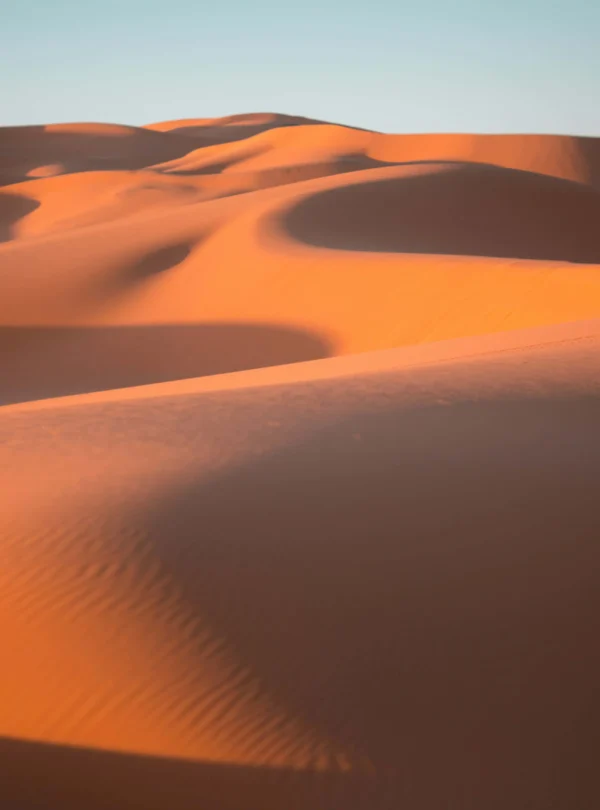 Golden Sahara dunes during Morocco Desert Tours at sunset