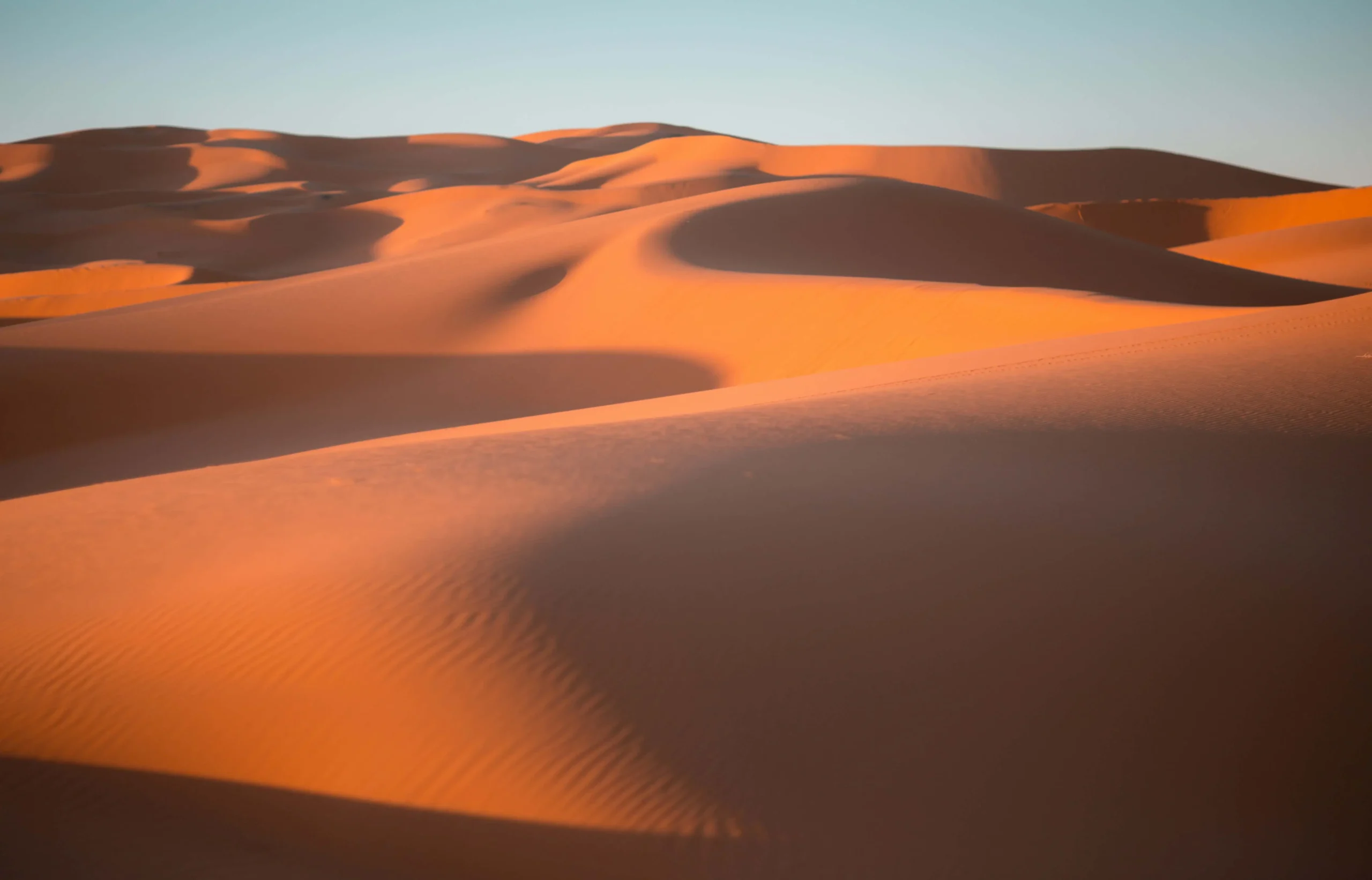 Golden Sahara dunes during Morocco Desert Tours at sunset