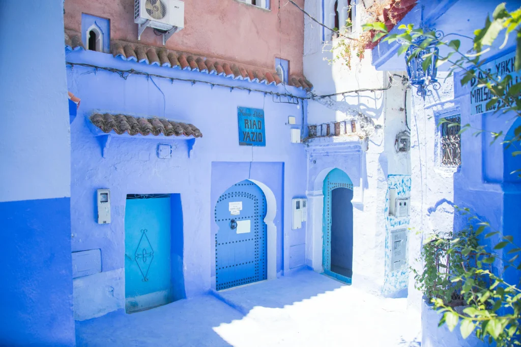 Chefchaouen Morocco local artisan weaving traditional textiles in blue medina