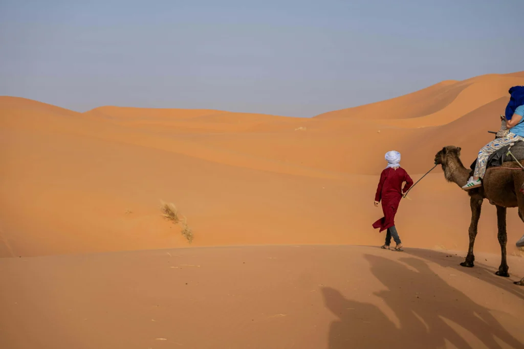 Fez Marrakech desert tour camel trekking at sunset