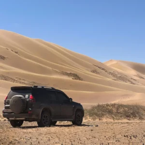 Luxury car with driver Morocco desert landscape professional service