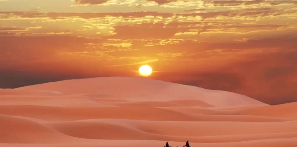 Morocco luxury tour exploring desert dunes at sunset
