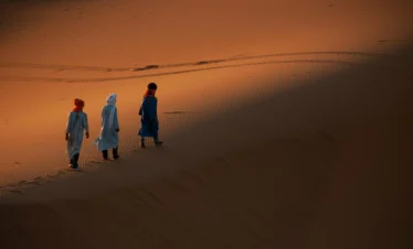 Camel caravan in Erg Chebbi during Marrakech to Fes desert tour 4 days