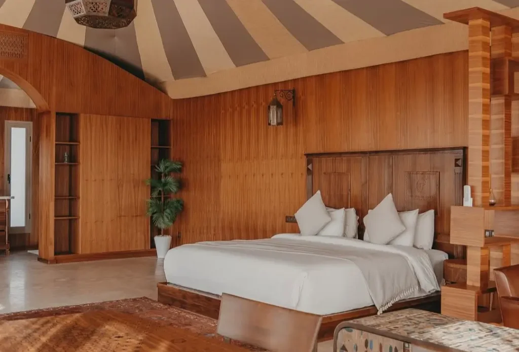 Agafay Desert Morocco White Camel luxury camp tent interior with elegant Berber decor