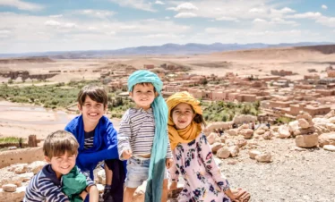Family enjoying Ait ben haddou sunset during an 11 days Morocco tour
